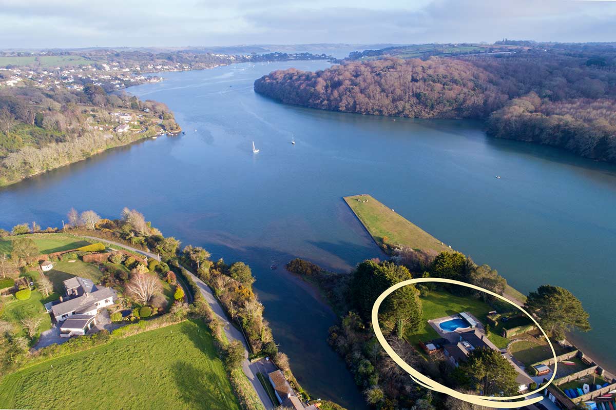 Lower Quay Cottage is in an enviable waterside location, shown here by the aerial photography of Restronguet Creek